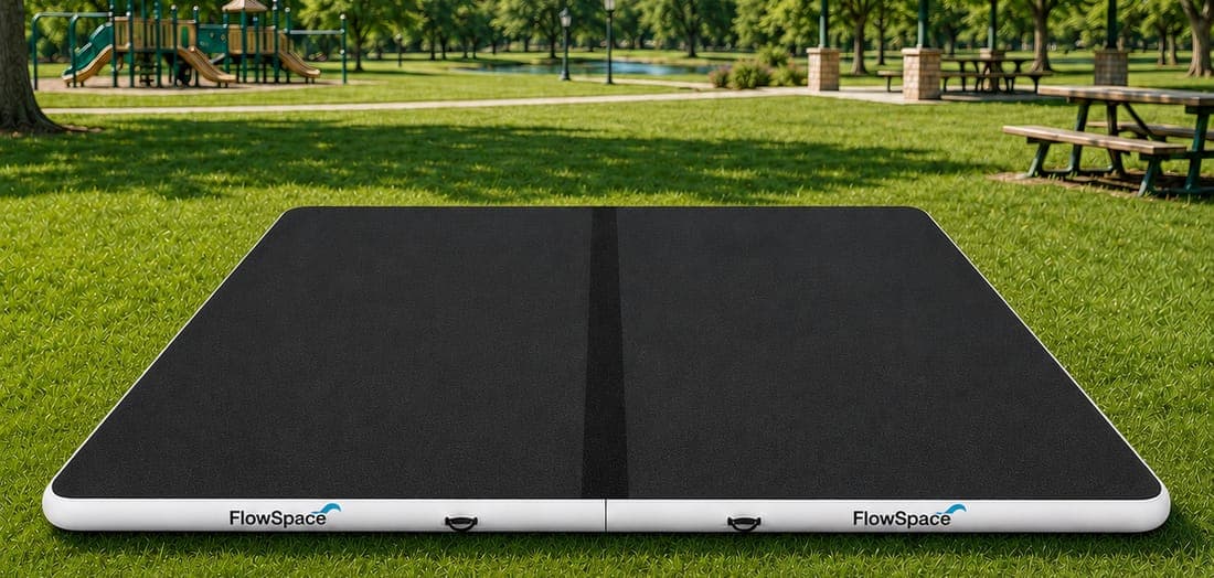 The 20 by 16 bundle, two mats joined end to end, set up on grass in a park