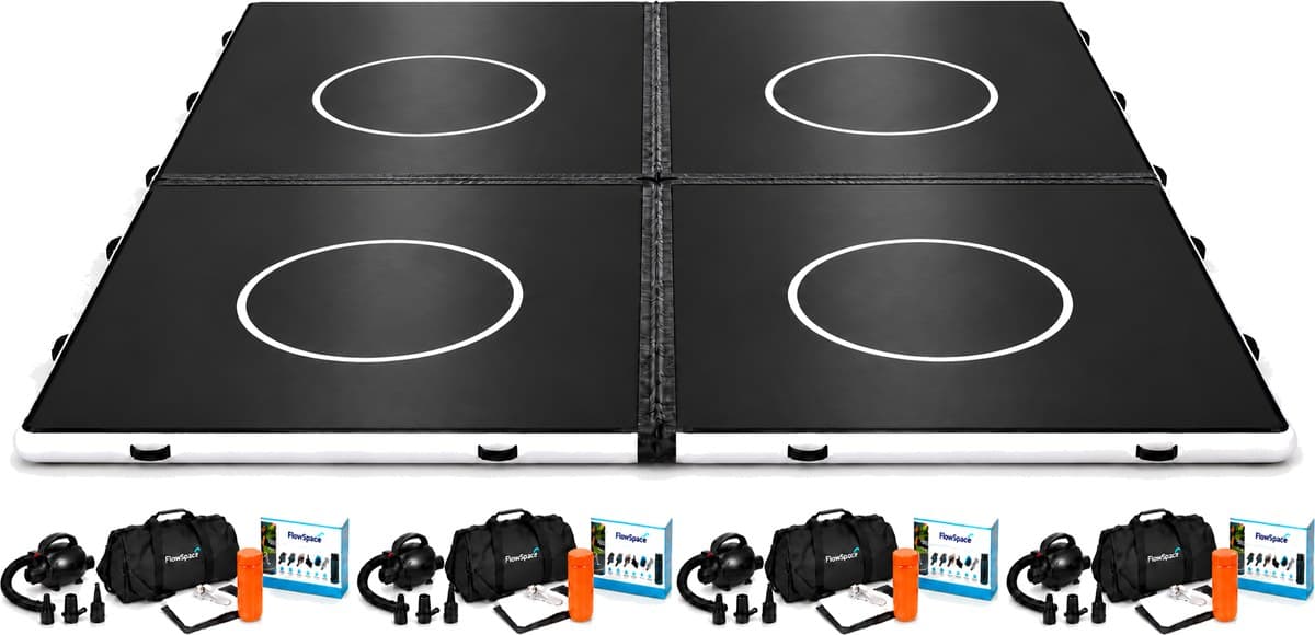 The complete 32 by 32 floor: four black 16 by 16 FlowMats joined two by two with velcro connectors, with four electric pumps, four duffle bags and four repair kits